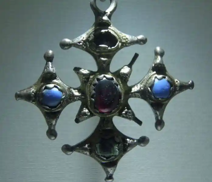 A cross pendant made up of mini-crosses